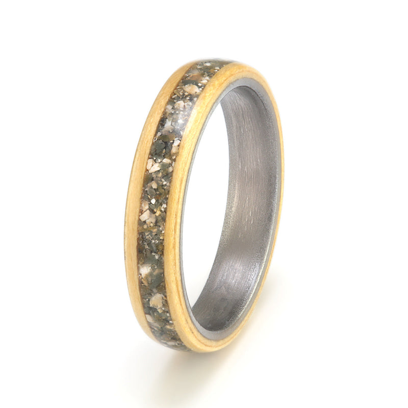 Australian wood ring | 4mm wide Huon Pine ring with a titanium liner and a 2mm centred inlay of customer provided pebbles