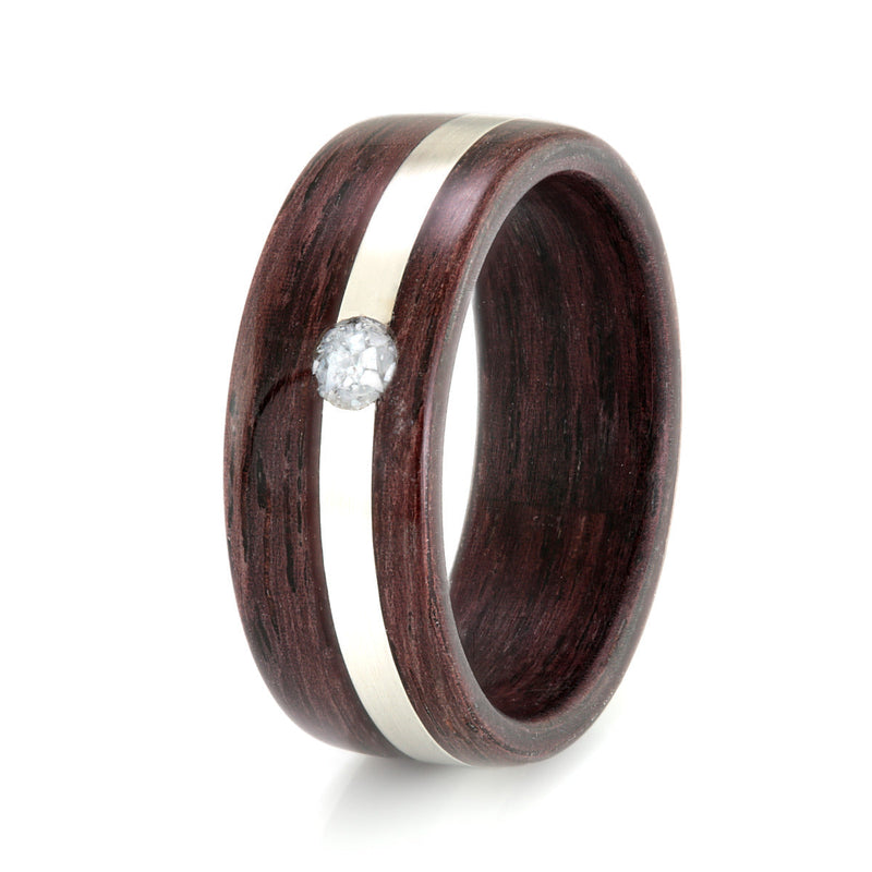 Unusual engagement ring | Indian rosewood ring with an off centre inlay of silver meeting at a circle of mother of pearl